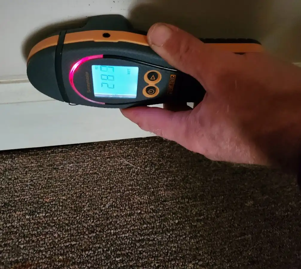 Moisture detection at baseboard during Storm Damage Restoration in South Charleston